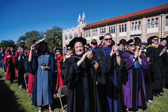 Delegates applaud during the investiture.