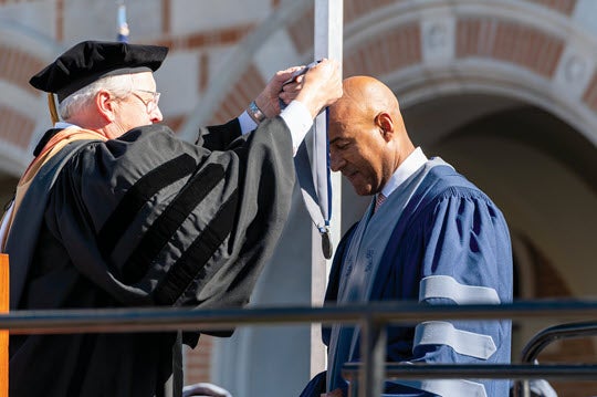 Robert T. Ladd presents Reginald DesRoches with the presidential medal